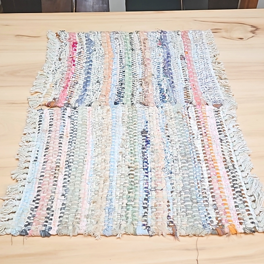 Set of two pastel hand made rag rug placemats.